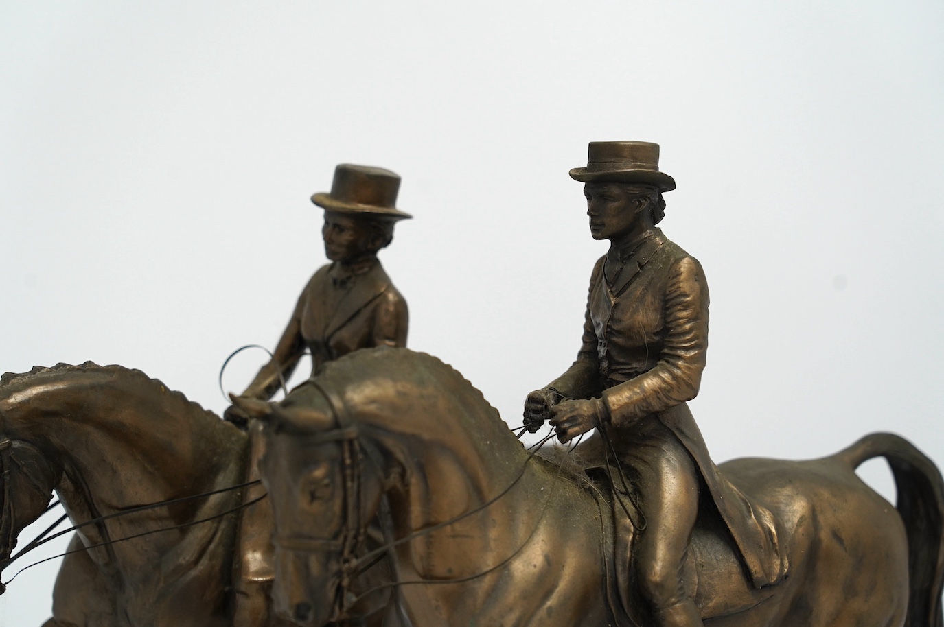 Harriet Glen and David Crenty, two cold cast resin bronze equestrian groups, 32cm wide. Condition - good